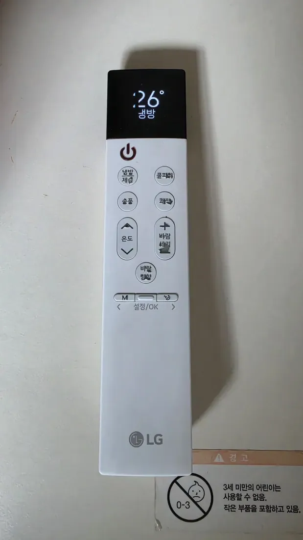 An LG air conditioner remote control showing cooling mode set to 26 degrees