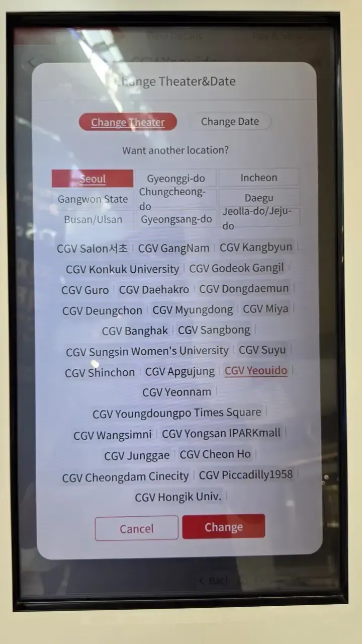 The CGV kiosk's Change Theater screen listing Seoul branches in English
