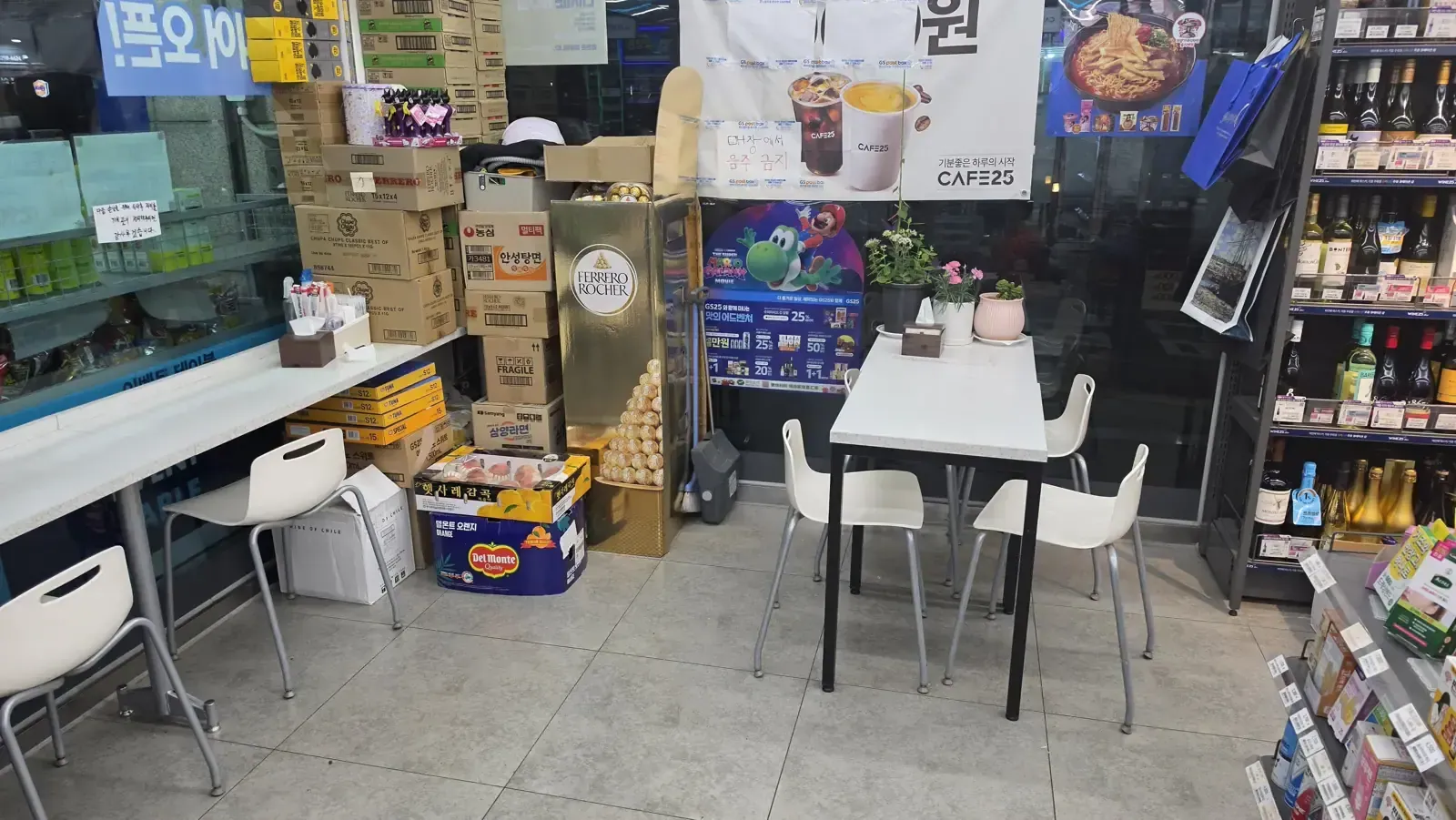 Tables and chairs set up for eating inside a Korean convenience store