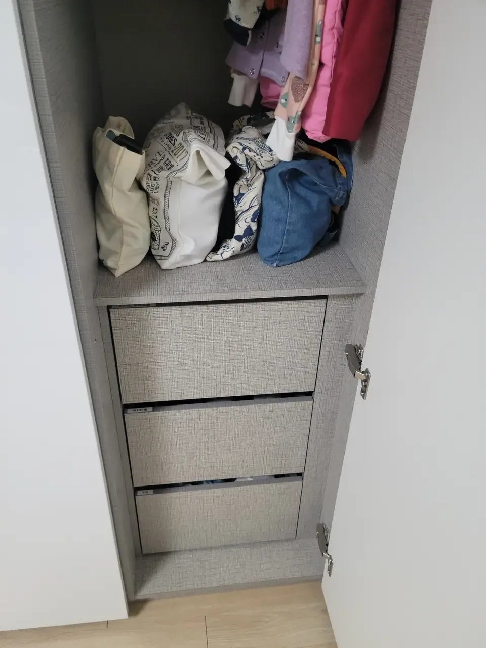 Cabinet doors after organising, each with a small printed label