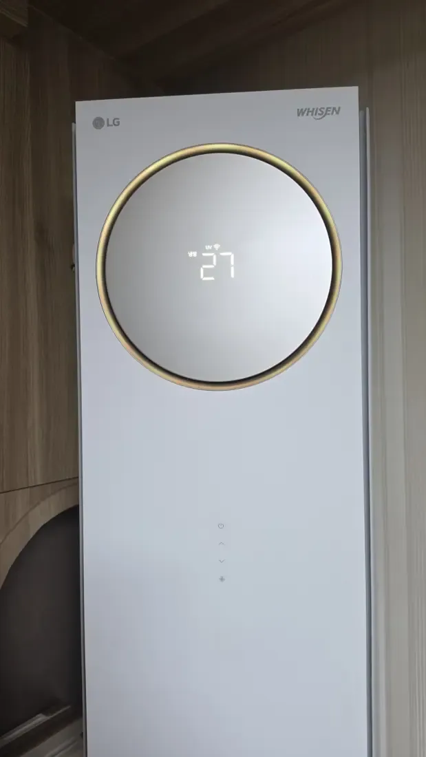 A tall LG tower air conditioner standing in the corner of a Korean apartment room
