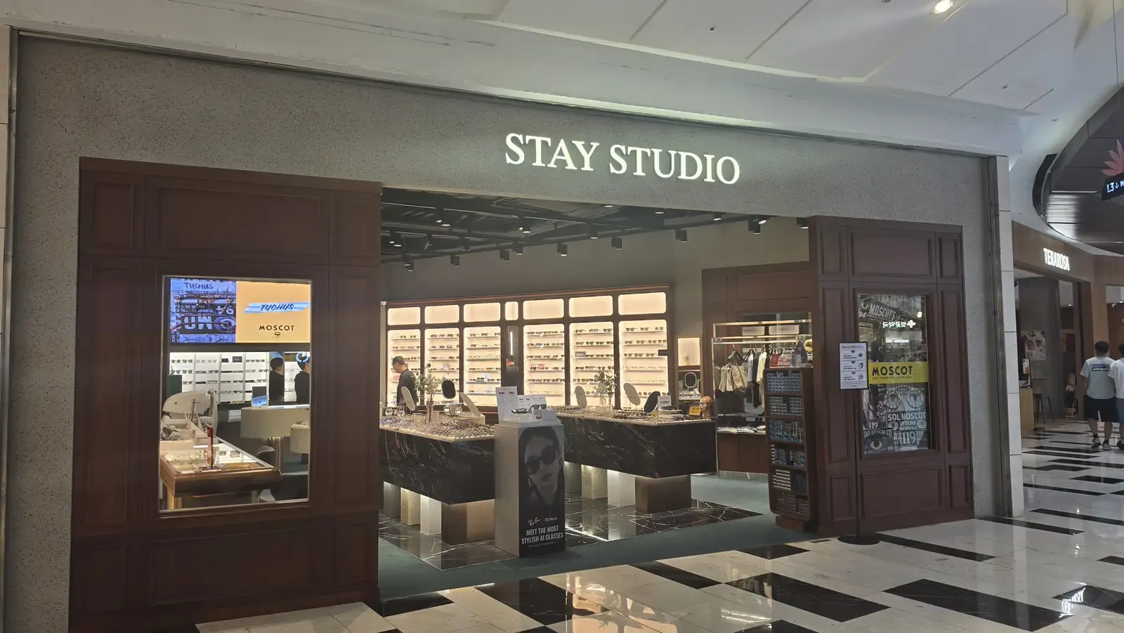 An eyewear shop inside IFC Mall in Yeouido, Seoul, with a wall of frames and sunglasses displayed
