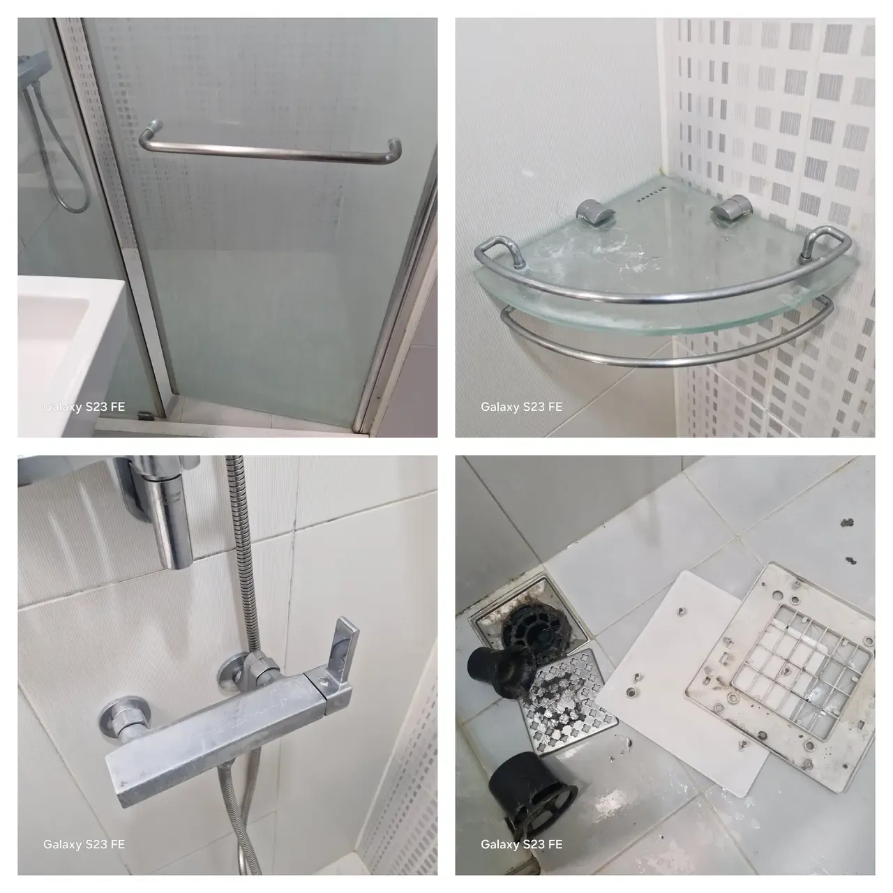 A shower screen and glass shelf clouded with limescale, a mixer tap, and the floor drain lifted out in pieces on the tiles